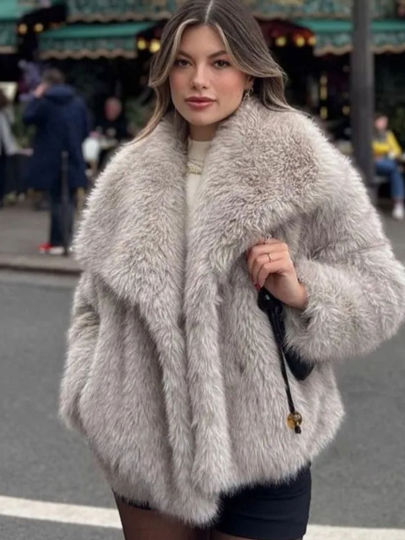 Embrace Winter's Warmth: Luxurious Plush Coat with Chic Lapel. Stay cozy and stylish all season long with this must-have winter coat. Featuring a thick, plush exterior for ultimate warmth, a sophisticated lapel design, and a relaxed, long-sleeve silhouett