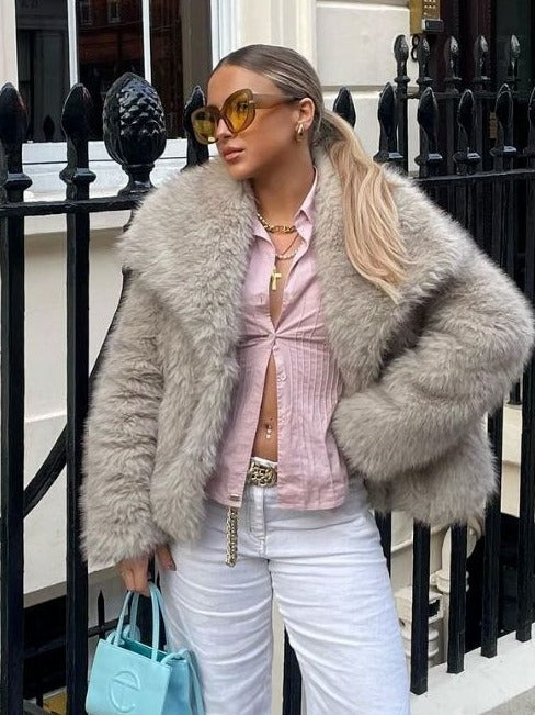 Embrace Winter's Warmth: Luxurious Plush Coat with Chic Lapel. Stay cozy and stylish all season long with this must-have winter coat. Featuring a thick, plush exterior for ultimate warmth, a sophisticated lapel design, and a relaxed, long-sleeve silhouett
